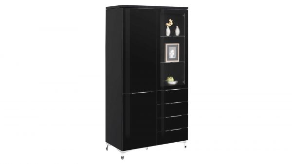 Die MAJA MÖBEL Vitrine Shino ist ein schwarzer Schrank mit vier Schubladen und offenen Fächern auf der einen Seite für Dekoration, einem hohen geschlossenen Schrank auf der anderen Seite und steht elegant auf vier silbernen Beinen.
